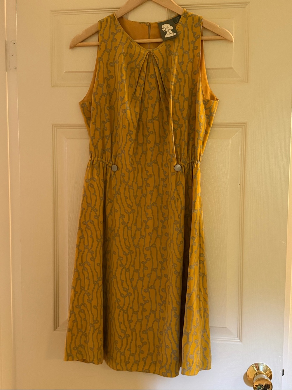 Silk and lined. Sleeveless Mustard Patterned Day Dress